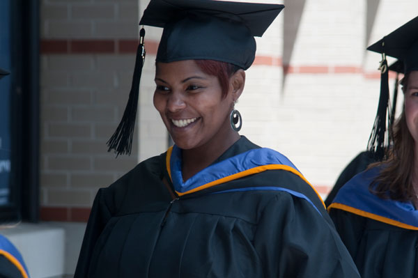 A nursing student prepares for the Saturday afternoon ceremony. 