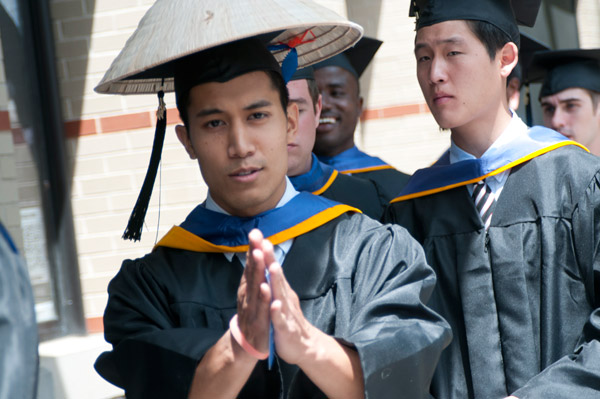 A graduate from the School of Transportation Technology adds a cultural twist to his cap and gown.