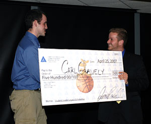 Carl F. Gravely accepts the inaugural Student Leader Legacy Scholarship check from 2006-07 SGA President James Riedel.