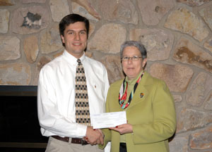 Dan Patin, a Harrisburg district service representative for Caterpillar, presents a check to Penn College President Dr. Davie Jane Gilmour.