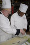 Chef Robert A. Armstrong offers tips to Ronnie E. Lindsay