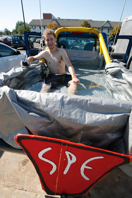 John Kulhamer, a plastics and polymer technology major and member of SPE, "chillaxin' and catchin' some rays" in the back of his pick-up truck lined with a tarp and filled with water 