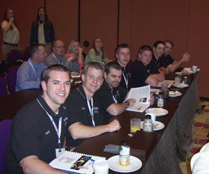 An impressive lineup attends a conference session.