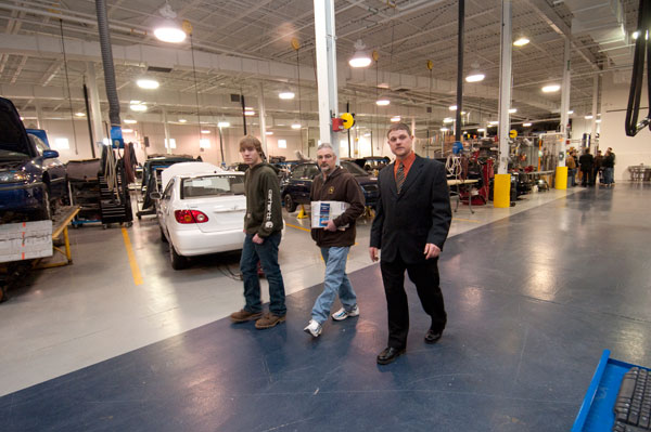 Faculty member Loren R. Bruckhart conducts a tour of the collision repair area of College Avenue Labs.
