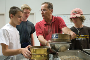 John J. Miknis, instructor of civil engineering technology, explains concrete mixing to campers. (Photo by Jessica L. Tobias, student photographer)