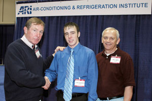 Wasielewski, center, is congratulated by Ray Mach, left, the Air-Conditioning and Refrigeration Institute%92s director of education and a co-chair of the %22Team USA%22 trials%3B and Larry Roberts of SkillsUSA.