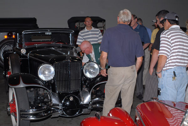 Allowed rare public entree to the museum's detail room, the Penn College contingent is shown a vintage Cord  the engine of which was manufactured in Williamsport.
