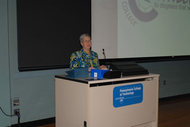 Penn College President Davie Jane Gilmour greets nontraditional students at a Connections session, bearing giveaways to four lucky students in the day's drawing for varied campus merchandise.