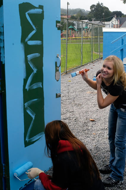 Kattie I. Heisey, president of the Penn College Sigma Sigma Sigma colony and an early childhood education major from Richfield (below); and Kayleigh M. Stonecipher, sorority sister and pre-dental hygiene student from Lock Haven, brighten the Little Mountaineer Little League field along West Southern Avenue in South Williamsport.
