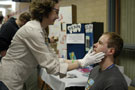 Dental hygiene student examines a visitor