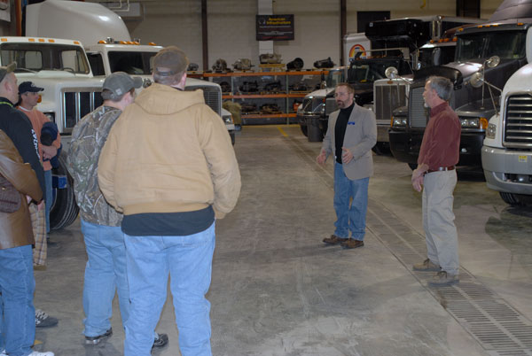 Diesel instructors Mark E. Sones and David C. Johnson (right) answers questions in an ESC lab.