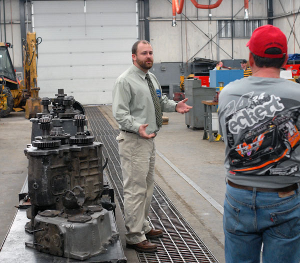 Paul A. Zenga, instructor of diesel equipment technology and heavy construction (and Penn College alumnus), takes a tour group through the Schneebeli Earth Science Center.