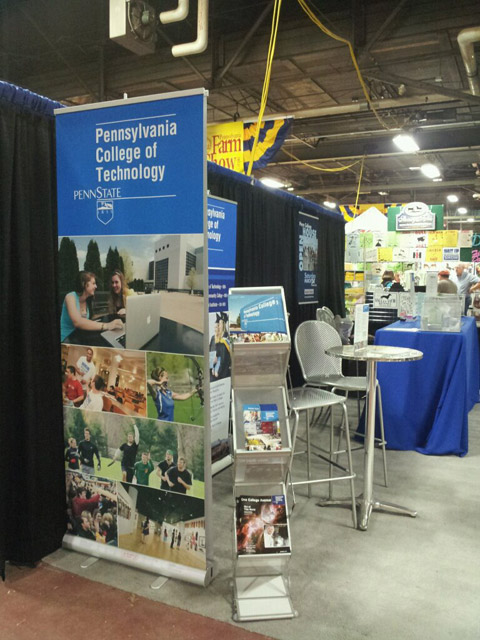 Attractive pull-up displays and other recruitment materials help tell "the Penn College story" at the Farm Show booth.