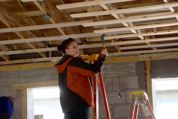 Kaitlyn Kennedy wields a hammer for Habitat