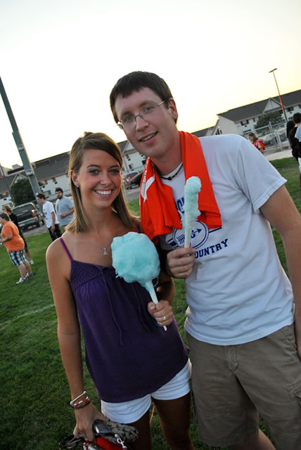 Alissa J. Harris and Derek J. Hoover enjoy the festivities (and the cotton candy) at the Wet-'n'-Wildcat House Party.
