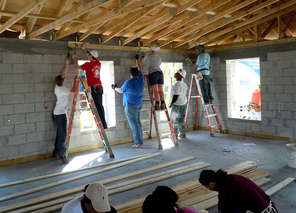 Penn College students apply elbow grease to one of the Habitat houses in Liberty City.