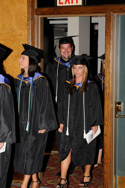 Commencement candidates show a mixture of joy, pensiveness upon entering the Arts Center.