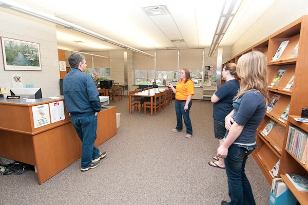 Kaila A. Sewald, of Williamsport, a sophomore in landscape/horticulture technology: plant production emphasis, gives a tour of the School of Natural Resources Management library.