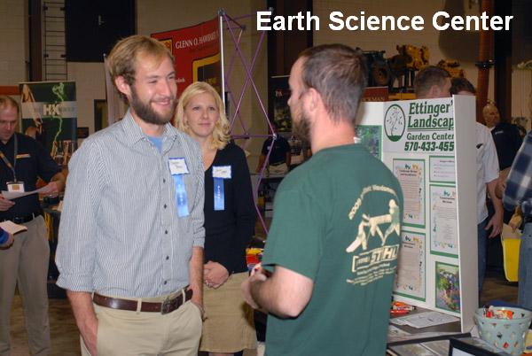 Alumni Stephen Petro and Julie Vogel work the "green" side of the room for Ettinger's Landscaping and Garden Center.