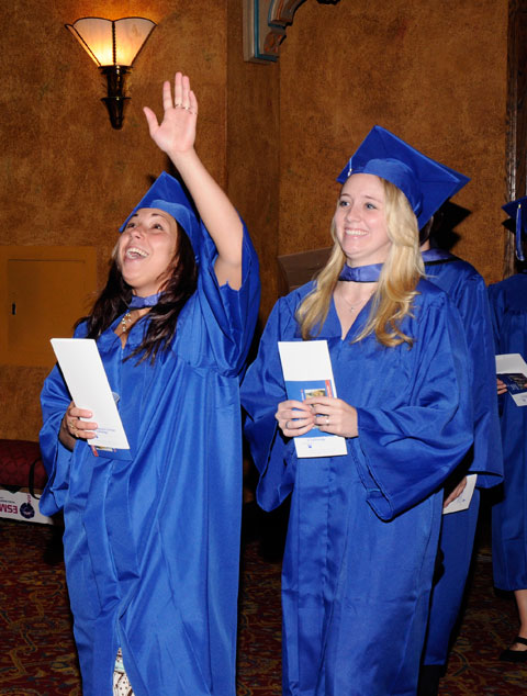 Graduating students find it hard to hide their happiness.