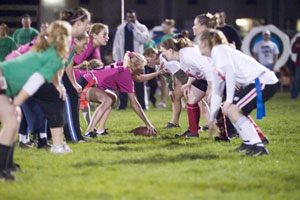 Opponents face off at the line of scrimmage during Sunday night's 'Powder Puff Football' game.