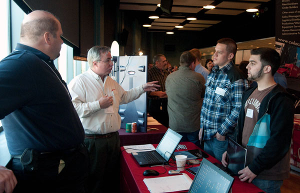 Job-seeking students are engaged at a booth for Honeywell International, Fort Washington.