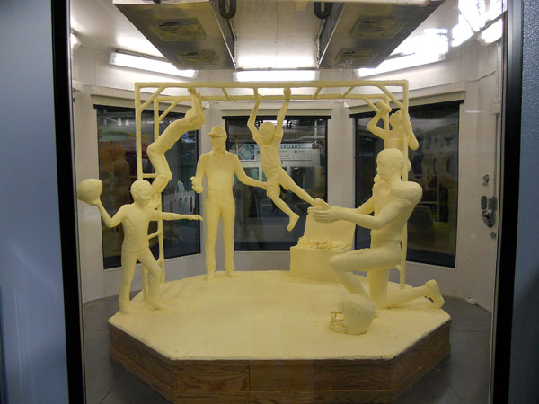 A half-ton of butter and 10 days' work went into this year's commemorative sculpture, depicting youthful recreation (and the healthful refreshment of milk).