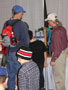 Electronics instructor Bruce M. Smith shows off a robot that handed out school lanyards to Farm Show visitors