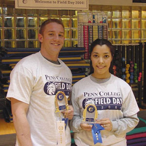 Mike Murzynski and Elizabeth Brown hold their 'Field Day' trophies. (Photo by Kristi L. Hammaker, Fitness Center supervisor)