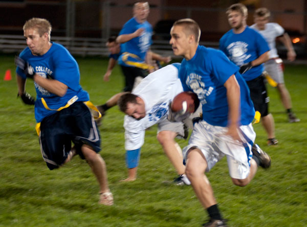 The blur of pursuit, as a defender gives chase during Thursday's flag football game between junior/senior and freshman/sophomore teams.