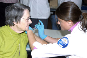 Jane Sallada, Cogan Station, receives a flu vaccination from Lauren C. Marino, Hornell, N.Y., a junior in the physician assistant major at Pennsylvania College of Technology, during a flu-shot clinic offered at The Campbell Street Center in Williamsport.