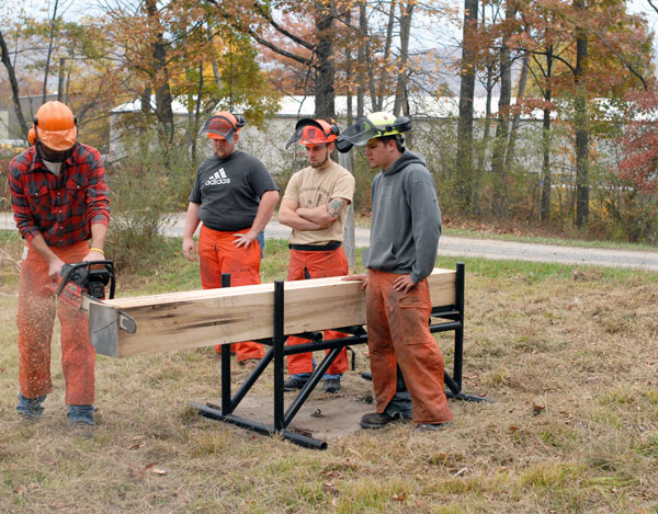 Surrounded by seasonal color at the Earth Science Campus near Allenwood, members of the Penn College Forestry Team prepare for competition.