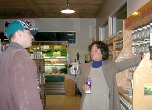 Student Brian A. Dixson tours the Freshlife Wellness Center with owner Barbara Jarmoska. (Photo by Mary G. Trometter)