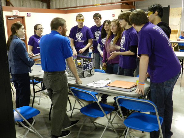 Rebecca Albert and Edward J. Almasy, instructor of electronics, act as judges for the Robo Warriors, a team hailing from Mifflin County High School in Lewistown.