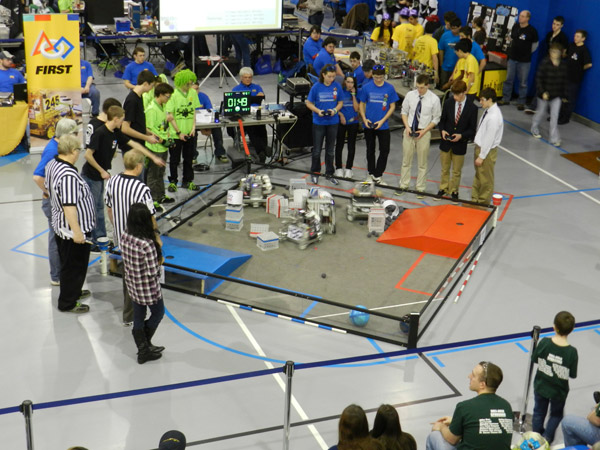 Four robots scramble under the control of their drivers during an elimination round.