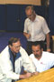 Preparing the hill-climb course are, clockwise from right, Roy H. Klinger, instructor of collision repair; Steve H. Wallace, assistant dean of transportation technology; and event organizer Dale E. Jaenke, assistant professor of automotive technology