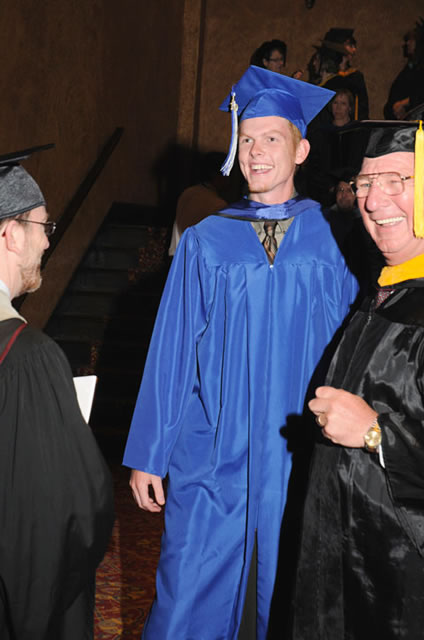 Speaker Garrett M. Book shares a laugh with Ward W. Caldwell, special assistant to the president for student affairs (left), and William J. Martin, the college's senior vice president.