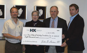 Pennsylvania College of Technology President Davie Jane Gilmour accepts a scholarship check from principals in the Haines %26amp%3B Kibblehouse Family of Companies%3A From left, John R. Kibblehouse Jr., John B. Haines and John A. Haines.