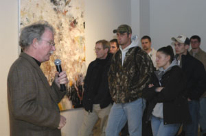 Timothy Hawkesworth talks with those attending his exhibit in The Gallery at Penn College.