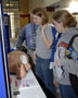 Nursing majors Rosanna L. Harkness, Canton, and Mandy Wohlschlegel, Lewisburg, talk emergency medical care with Craig Konkle, regional EMS field coordinator
