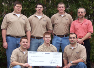 Holding their %242,000 check for a first-place finish in the Heavy Highway category are, front row from left, Paul F. Mueller Jr., Kyle S. Flook and Nick A. Angelopulos, and, back row from left, Richard M. Donovan, Stephen A. Langendoerfer, Daniel M. Kmetz and faculty coach Dennis R. Dorward.