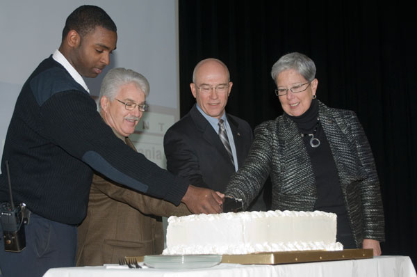 August 2009 emergency medical services graduate Rudolph Downie joins Chuck Stutzman, a graduate of the program's first class in 1979, Susquehanna Health President Steven Johnson, and Penn College President Davie Jane Gilmour to cut a 30th-anniversary cake.