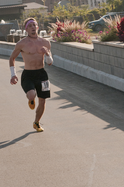 Top runner Travis Cain heads for the 5K finish line.