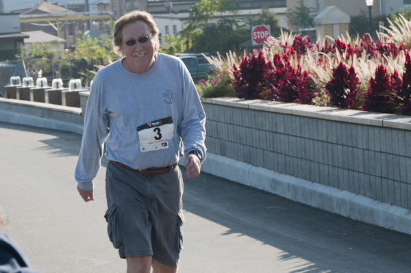 Cross-country head coach Mike Paulhamus is the first walker to finish in the Health Sciences fundraiser.