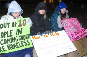From left, Penn College students Kara S. Mifsud, Sara E. Baker and Amanda R. Stepp brave the cold and snow to call attention to the plight of the homeless.