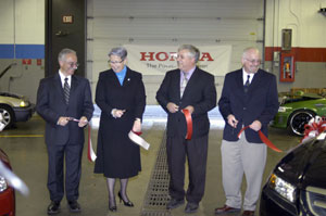 Cutting the ribbon to officially launch Pennsylvania College of Technology's role as a Honda PACT school are, from left, John G. Petas, Honda senior vice president of parts and service operations%3B Penn College President Davie Jane Gilmour%3B Colin W. Williamson, dean of transportation technology%3B and Brian Moore, Honda industry education coordinator.