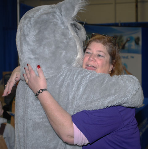 The Wildcat finds another in a daylong series of happy huggers.