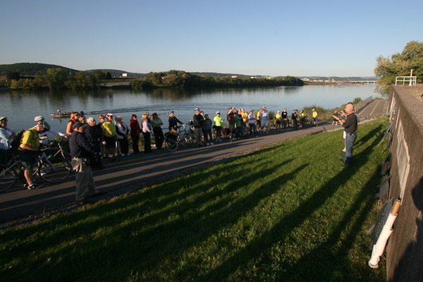 With the West Branch of the Susquehanna as its scenic backdrop, a bike tour that included Penn College students, employees and alumni stops to preview Riverwalk sculpture.