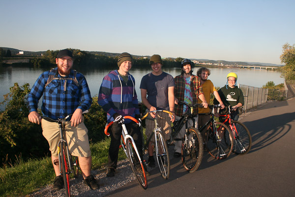 A mix of alumni and current students, several from Penn College's welding majors, bike to the Riverwalk.