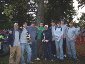 From left, students Justin A. Eshelman and Nicholas J. Klein%3B driving coach Thomas D. Inman, associate professor of avionics%3B and students Michael B. Ferrucci, Shaun M. McQuay, John R. Deihl, Justine R. Wareham, Daniel P. Clark  and Linh H. Do.